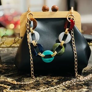 Chic Black Handbag with Colorful Chain